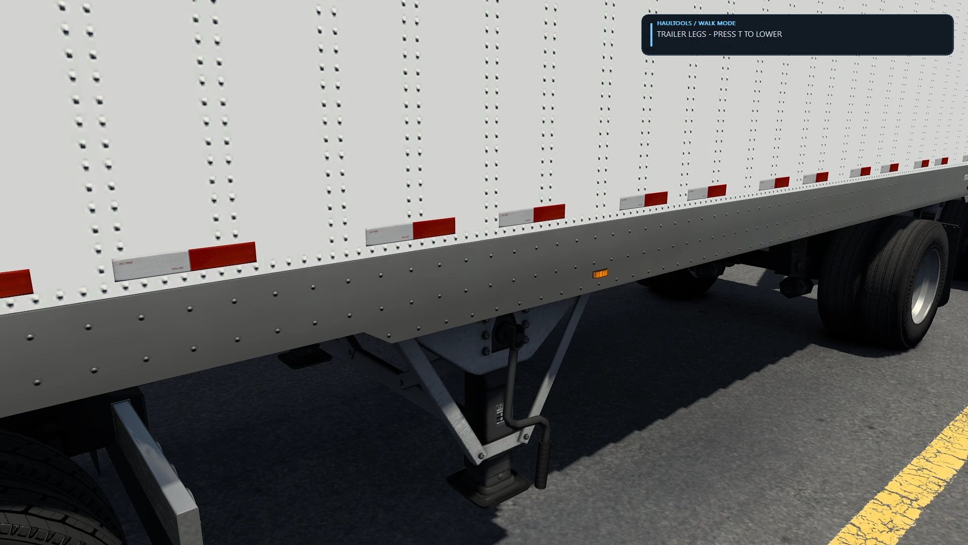Trailer landing legs with the HaulTools prompt to lower them during unhook.