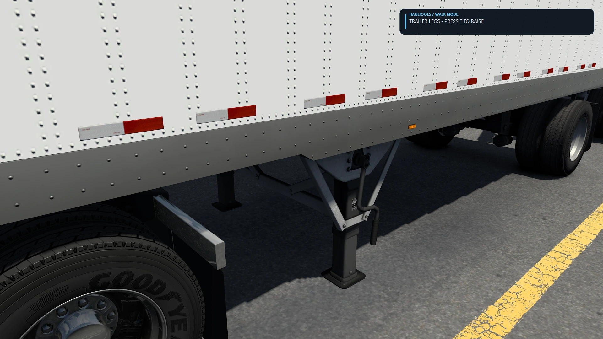 Trailer landing legs with the HaulTools prompt to raise them during hookup.